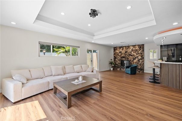 Fireplace, Interior, Living room, Recessed Lighting, Stone Walls, Wood Texture Flooring