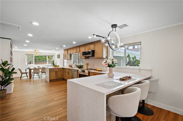 Dining room, Interior, Kitchen, Pendant Lights, Recessed Lighting, Stainless Steel Appliances, Wood Texture Flooring