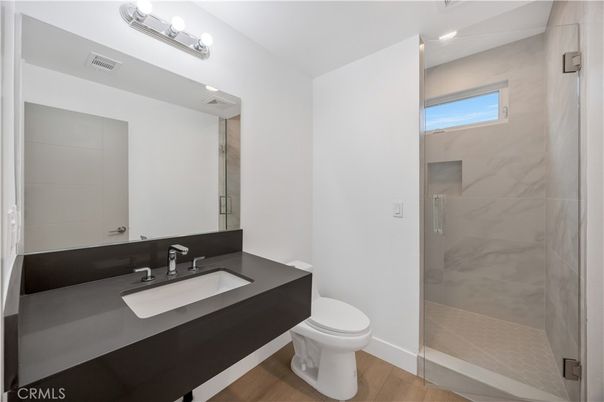 Bathroom, Glass Shower, Interior, Marble Walls, Wood Texture Flooring