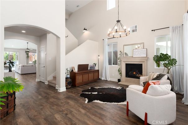 Chandelier, Fireplace, Interior, Living room, Pendant Lights, Recessed Lighting, Wood Texture Flooring