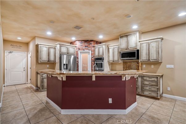 Interior, Kitchen, Recessed Lighting, Stainless Steel Appliances, Stone Walls