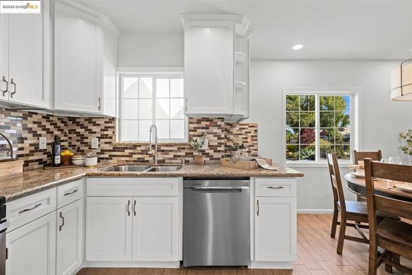 Dining room, Interior, Kitchen, Recessed Lighting, Stainless Steel Appliances, Wood Texture Flooring