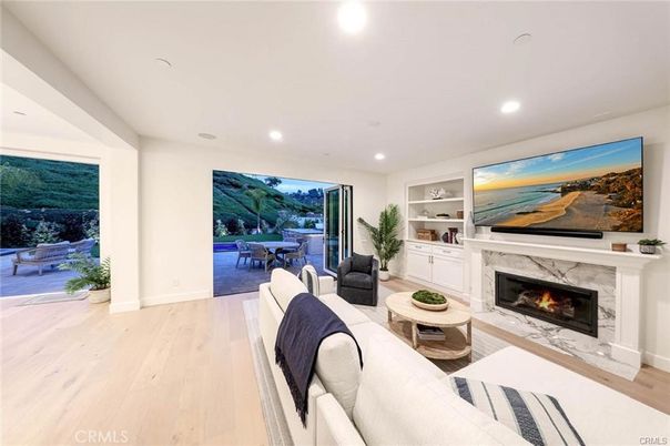 Dining room, Fireplace, Interior, Living room, Recessed Lighting, Wood Texture Flooring