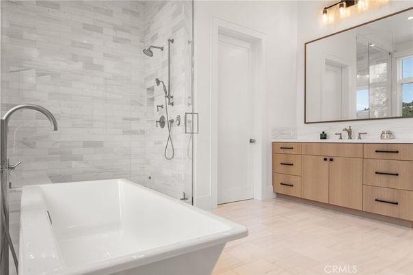 Bathroom, Dual Sink Vanities, Free Standing Baths, Glass Shower, Interior, Marble Walls, Wood Texture Flooring
