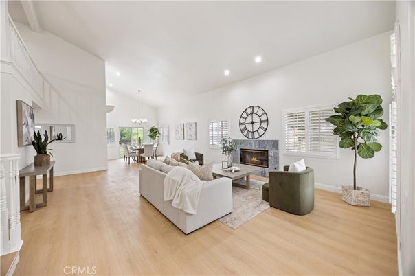 Chandelier, Dining room, Fireplace, Interior, Living room, Pendant Lights, Recessed Lighting, Wood Texture Flooring