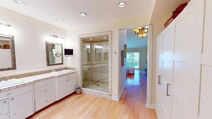 Bathroom, Dual Sink Vanities, Glass Shower, Interior, Recessed Lighting, Tile Countertops, Wood Texture Flooring