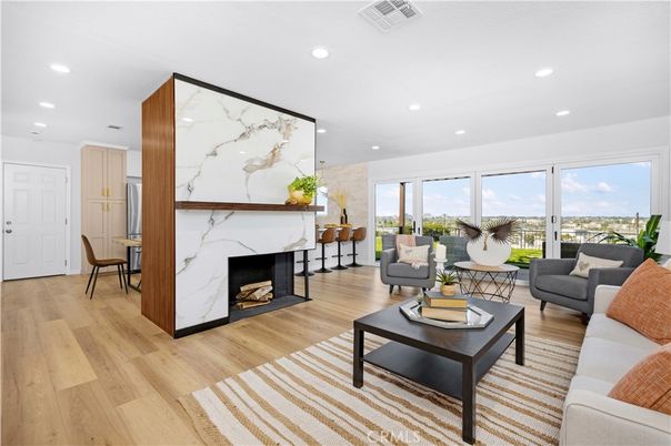 Fireplace, Interior, Living room, Marble Walls, Recessed Lighting, Wood Texture Flooring