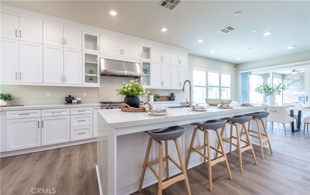 Dining room, Interior, Kitchen, Recessed Lighting, Stainless Steel Appliances, Wood Texture Flooring