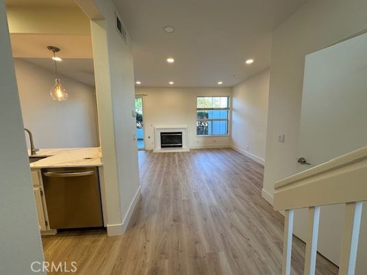 Empty room, Fireplace, Interior, Pendant Lights, Recessed Lighting, Wood Texture Flooring