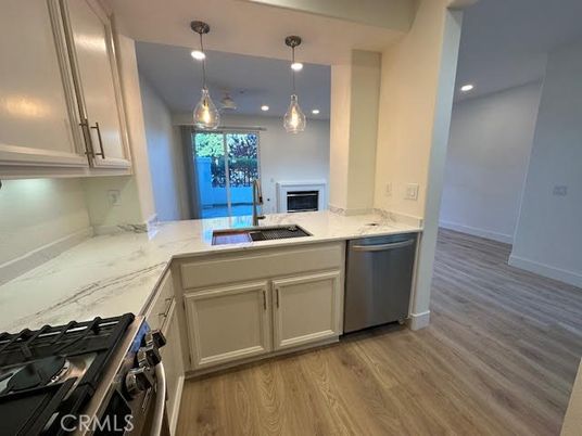 Fireplace, Interior, Kitchen, Pendant Lights, Recessed Lighting, Stainless Steel Appliances, Wood Texture Flooring