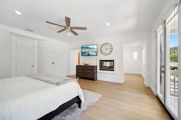 Bedroom, Fireplace, Interior, Recessed Lighting, Wood Texture Flooring