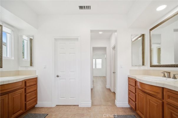 Bathroom, Dual Sink Vanities, Interior, Recessed Lighting, Tile Countertops, Wood Texture Flooring