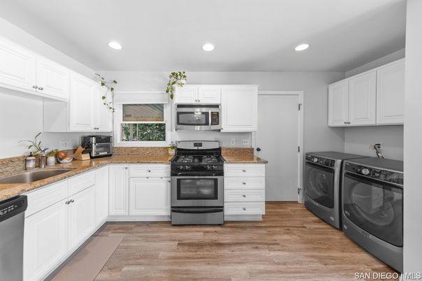 Interior, Kitchen, Recessed Lighting, Washer, Wood Texture Flooring