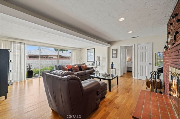 Fireplace, Interior, Living room, Recessed Lighting, Stone Walls, Wood Texture Flooring