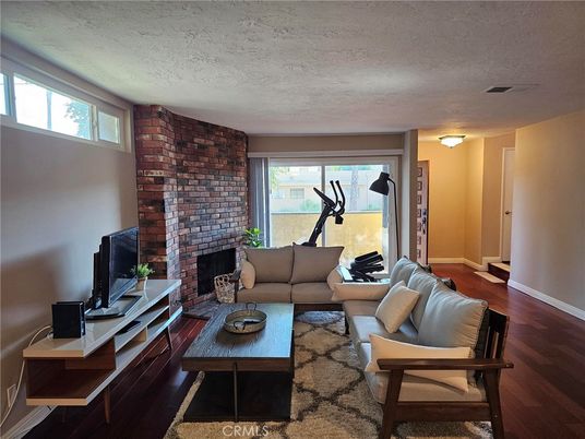 Fireplace, Fitness Equipment, Interior, Living room, Stone Walls, Wood Texture Flooring