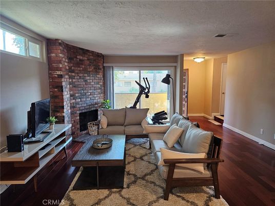 Fireplace, Fitness Equipment, Interior, Living room, Stone Walls, Wood Texture Flooring