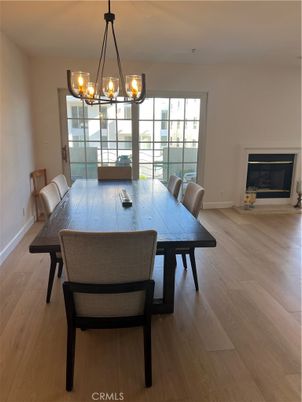Chandelier, Dining room, Fireplace, Interior, Wood Texture Flooring