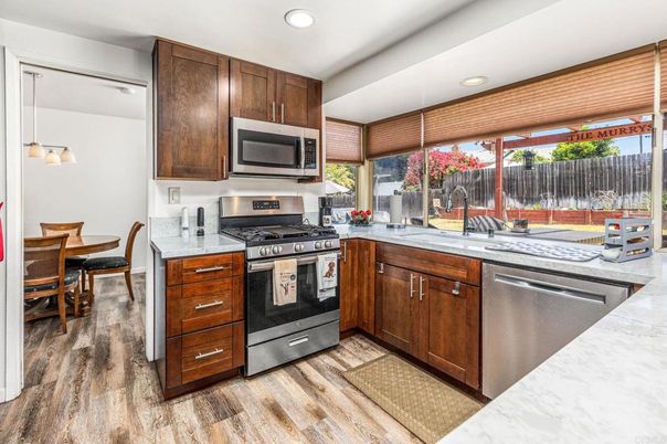 Dining room, Interior, Kitchen, Pendant Lights, Recessed Lighting, Stainless Steel Appliances, Wood Texture Flooring
