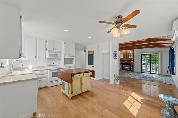 Fireplace, Interior, Kitchen, Recessed Lighting, Wood Texture Flooring