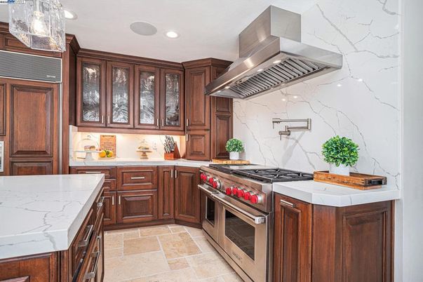 Interior, Kitchen, Marble Walls, Recessed Lighting, Stainless Steel Appliances