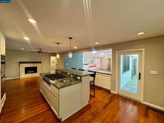 Fireplace, Interior, Kitchen, Pendant Lights, Recessed Lighting, Wood Texture Flooring