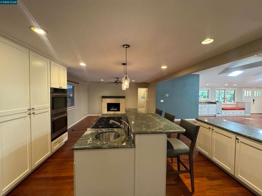 Dining room, Interior, Kitchen, Pendant Lights, Recessed Lighting, Stainless Steel Appliances, Wood Texture Flooring