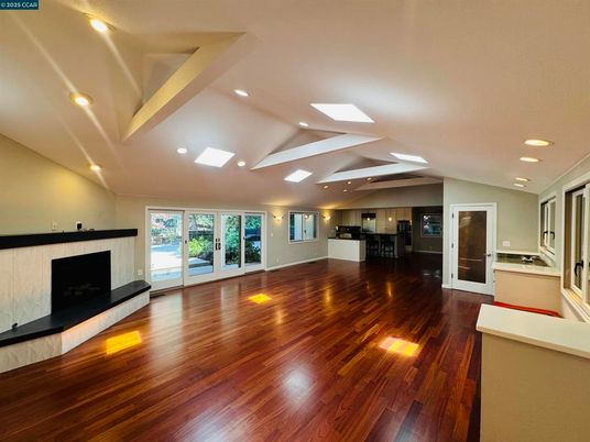 Empty room, Fireplace, Interior, Kitchen, Recessed Lighting, Wood Texture Flooring