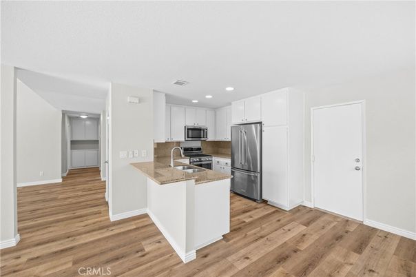 Interior, Kitchen, Recessed Lighting, Stainless Steel Appliances, Wood Texture Flooring