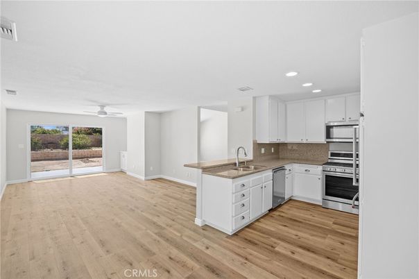 Interior, Kitchen, Recessed Lighting, Stainless Steel Appliances, Wood Texture Flooring