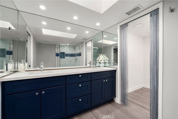 Bathroom, Dual Sink Vanities, Glass Shower, Interior, Recessed Lighting, Wood Texture Flooring