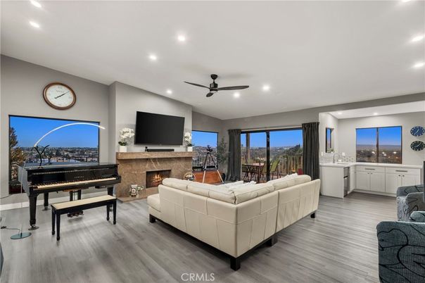 Fireplace, Interior, Living room, Piano, Recessed Lighting, Wood Texture Flooring