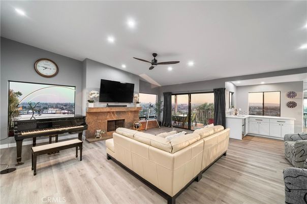 Fireplace, Interior, Living room, Piano, Recessed Lighting, Wood Texture Flooring