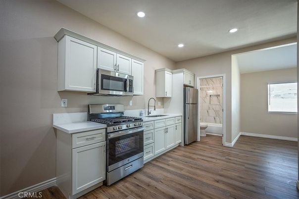 Interior, Kitchen, Recessed Lighting, Stainless Steel Appliances, Wood Texture Flooring