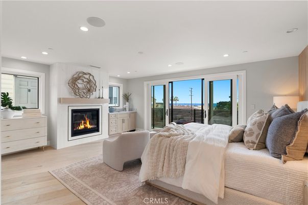 Bedroom, Fireplace, Interior, Recessed Lighting, Water, Wood Texture Flooring