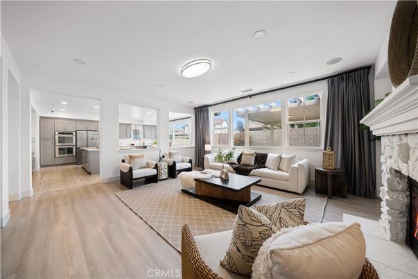 Fireplace, Interior, Kitchen, Living room, Recessed Lighting, Stainless Steel Appliances, Wood Texture Flooring