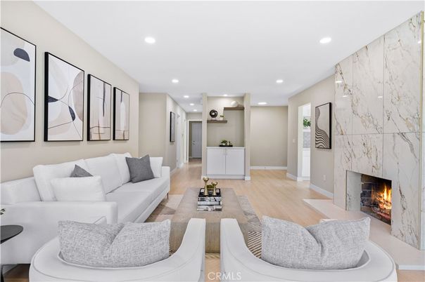 Fireplace, Interior, Living room, Marble Walls, Recessed Lighting, Wood Texture Flooring