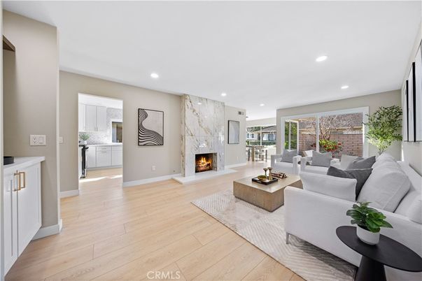 Fireplace, Interior, Living room, Marble Walls, Recessed Lighting, Wood Texture Flooring