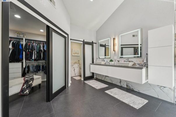 Bathroom, Dual Sink Vanities, Interior, Marble, Recessed Lighting, Walk-in Closets