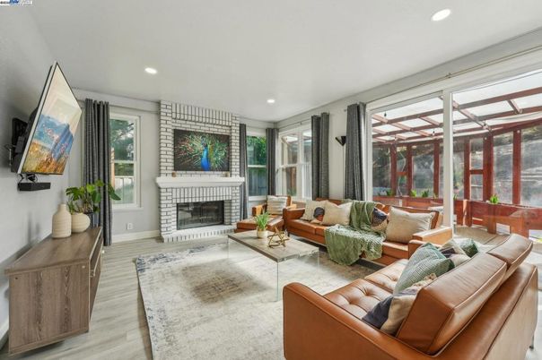 Fireplace, Interior, Living room, Recessed Lighting, Stone Walls, Wood Texture Flooring