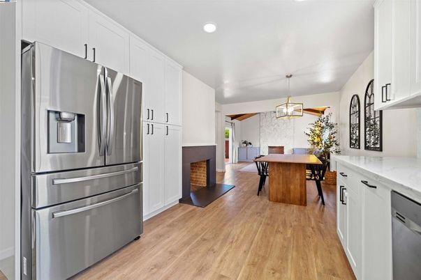 Dining room, Fireplace, Interior, Kitchen, Pendant Lights, Recessed Lighting, Stainless Steel Appliances, Wood Texture Flooring
