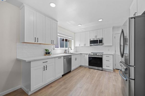 Interior, Kitchen, Recessed Lighting, Stainless Steel Appliances, Wood Texture Flooring