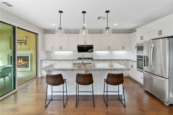 Fireplace, Interior, Kitchen, Pendant Lights, Recessed Lighting, Stainless Steel Appliances, Wood Texture Flooring