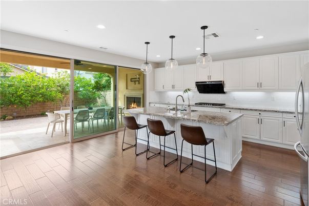 Fireplace, Interior, Kitchen, Pendant Lights, Recessed Lighting, Stainless Steel Appliances, Wood Texture Flooring