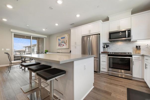 Dining room, Interior, Kitchen, Recessed Lighting, Stainless Steel Appliances, Wood Texture Flooring