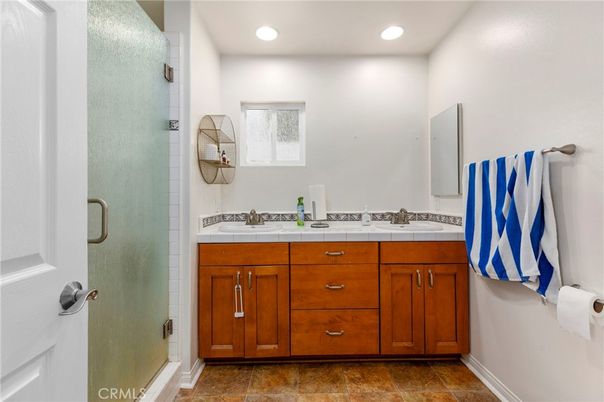 Bathroom, Dual Sink Vanities, Glass Shower, Interior, Recessed Lighting, Tile Countertops