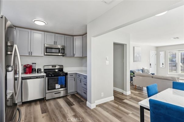 Dining room, Interior, Kitchen, Living room, Recessed Lighting, Stainless Steel Appliances, Wood Texture Flooring