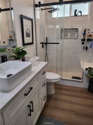 Bathroom, Dual Sink Vanities, Glass Shower, Interior, Wood Texture Flooring