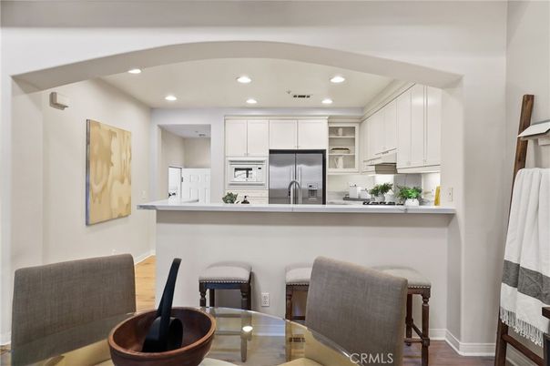 Dining room, Interior, Kitchen, Recessed Lighting, Stainless Steel Appliances, Wood Texture Flooring