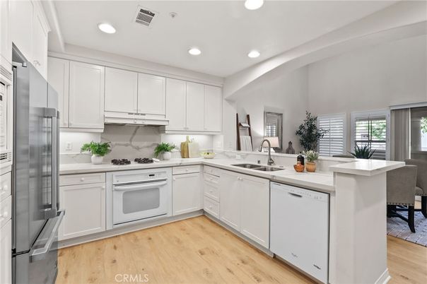 Dining room, Interior, Kitchen, Recessed Lighting, Stainless Steel Appliances, Wood Texture Flooring