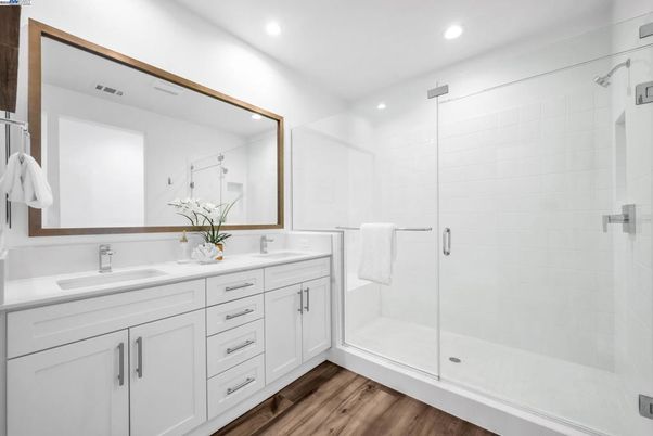 Bathroom, Dual Sink Vanities, Glass Shower, Interior, Recessed Lighting, Wood Texture Flooring